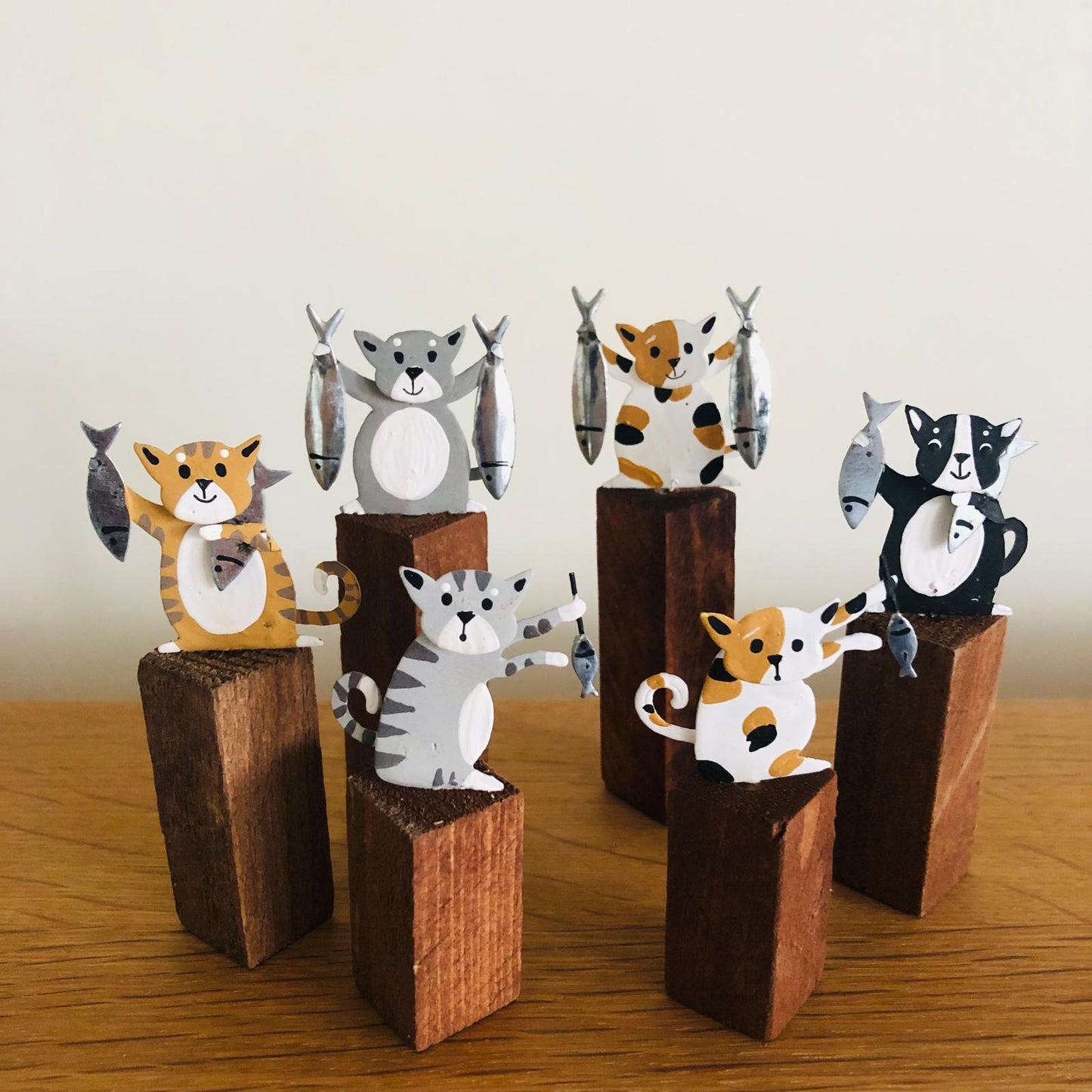 Cats with Fish on Plinths - ad&i