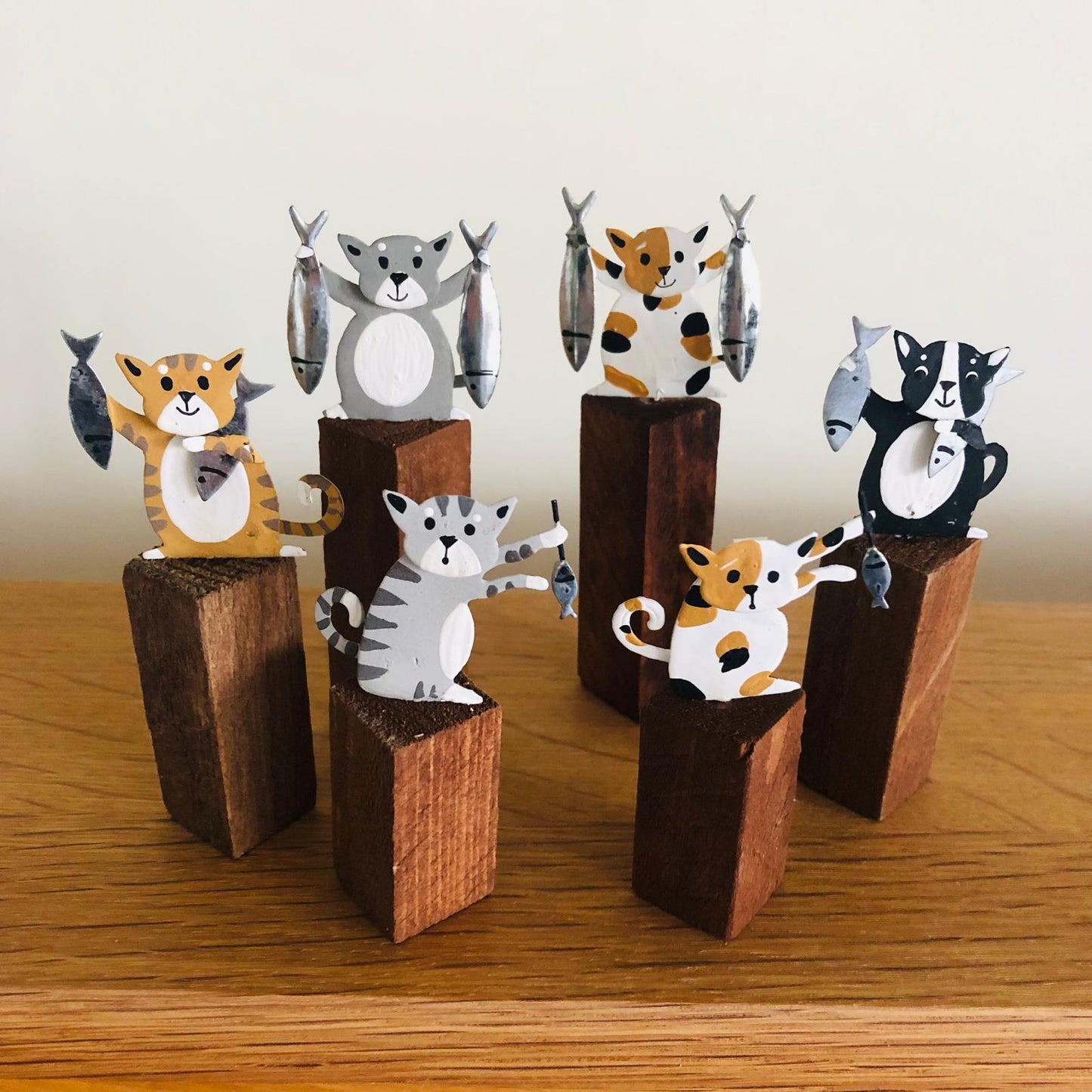 Cats with Fish on Plinths - ad&i