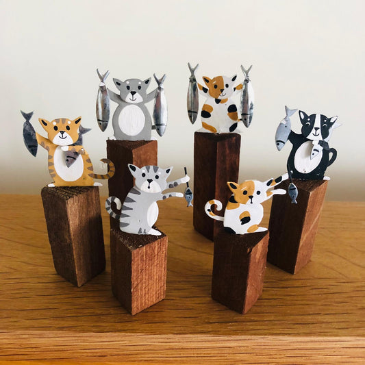 Cats with Fish on Plinths - ad&i