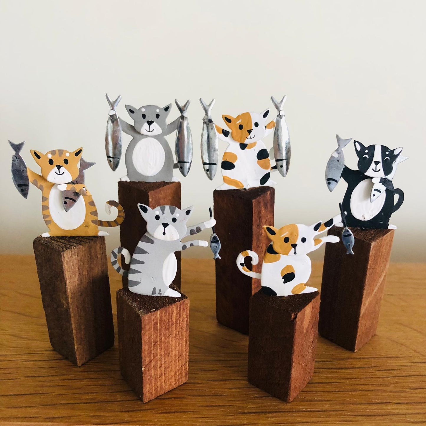 Cats with Fish on Plinths - ad&i
