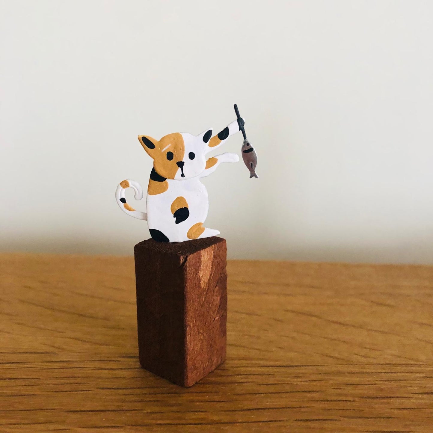 Cats with Fish on Plinths - ad&i