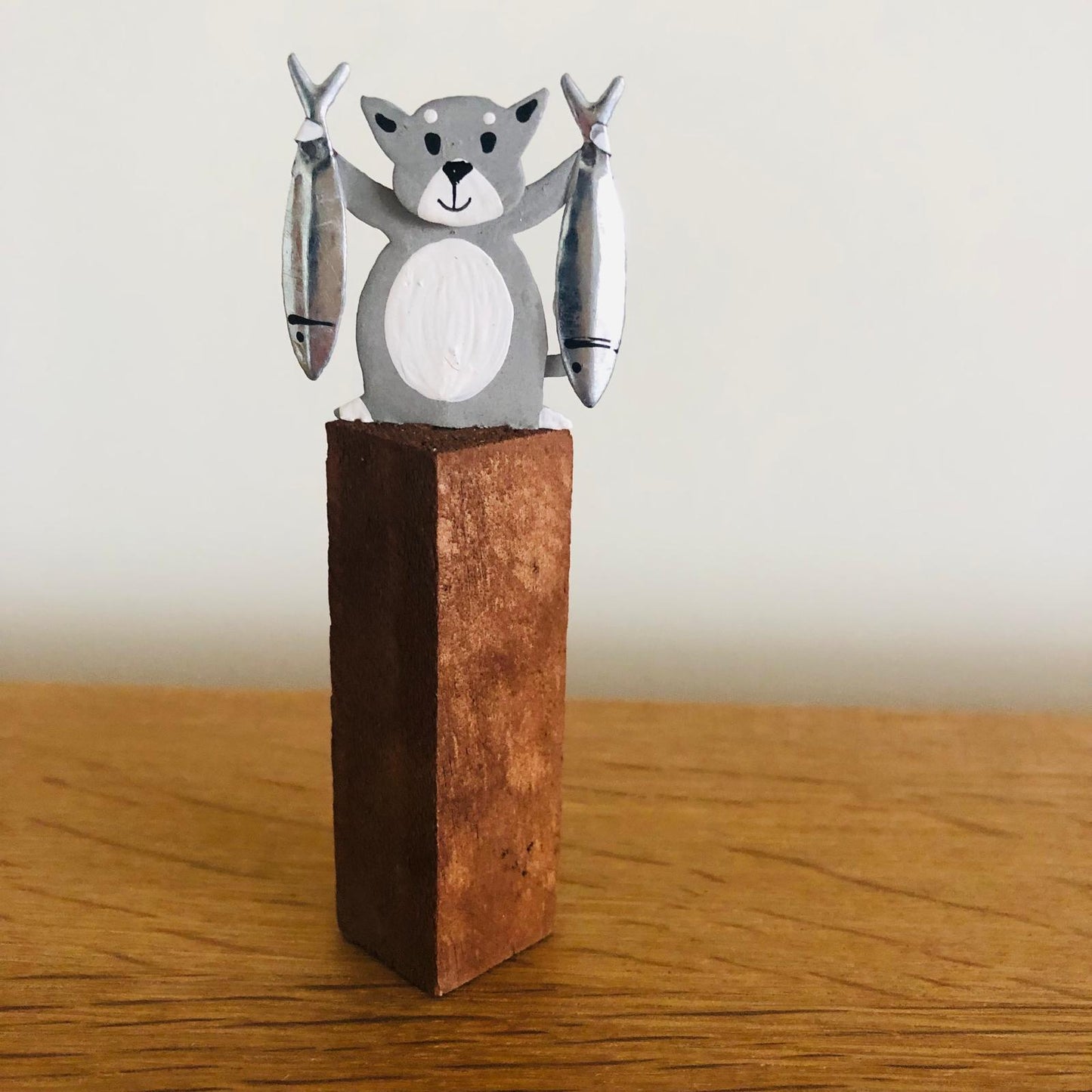 Cats with Fish on Plinths - ad&i