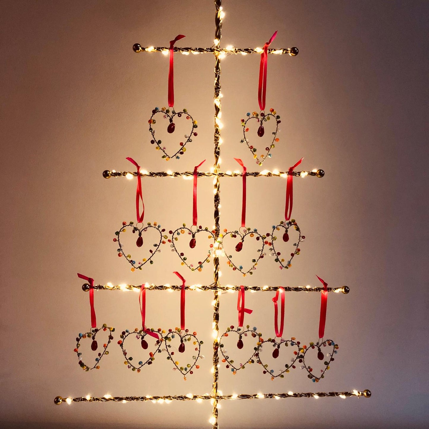 Decorative heart shapes and lights on a plain background