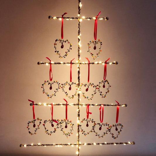 Decorative heart shapes and lights on a plain background